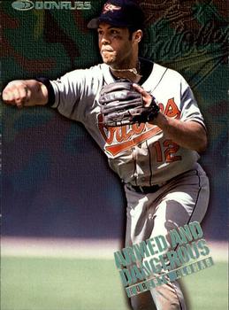 1997 Donruss - Armed and Dangerous #14 Roberto Alomar Front