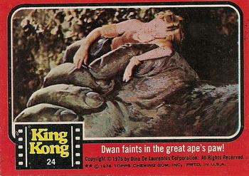 1976 Topps King Kong #24 Dwan faints in the great ape's paw! Front